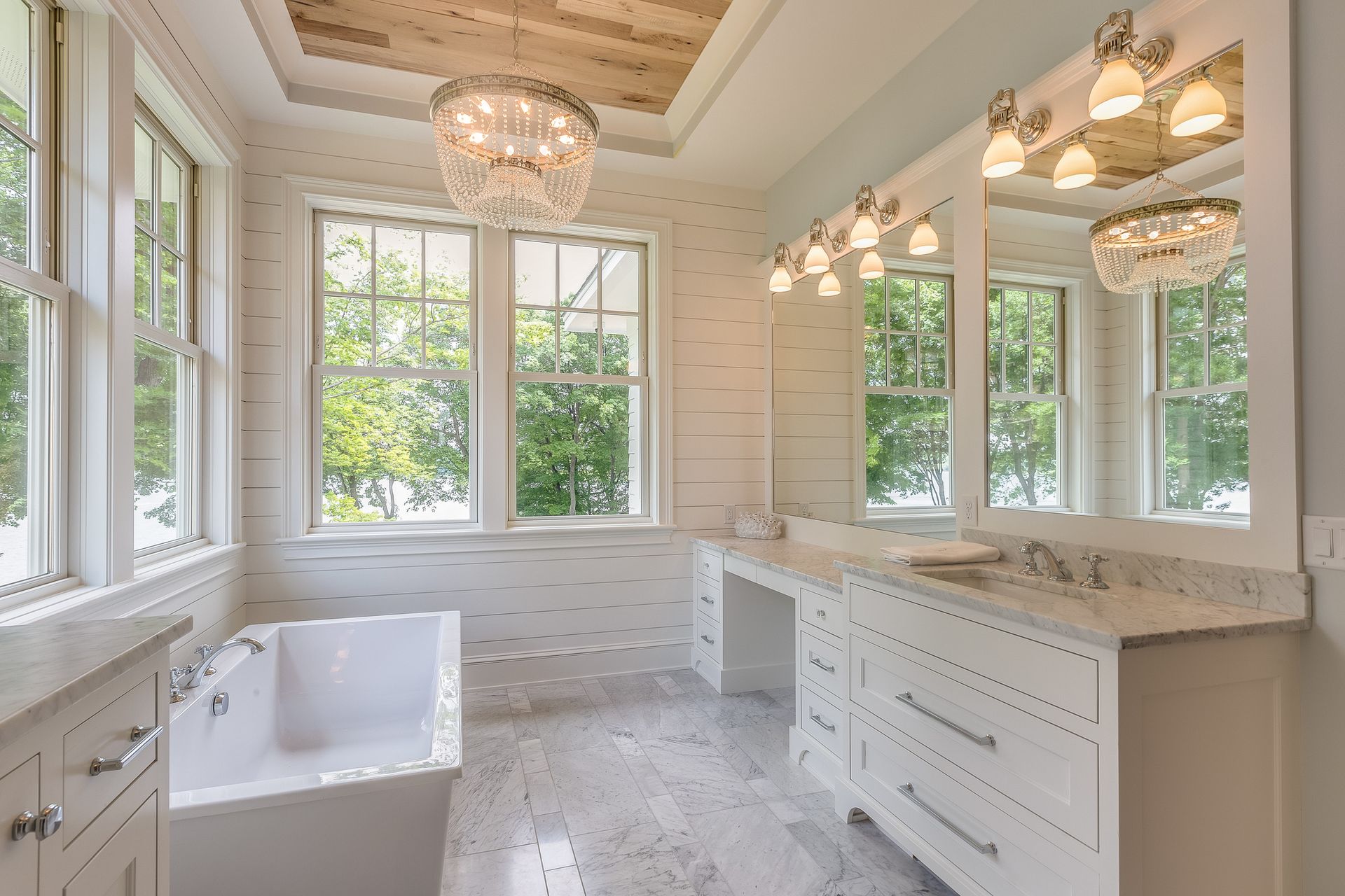 A walk-in shower with a glass enclosure replacing an old bathtub