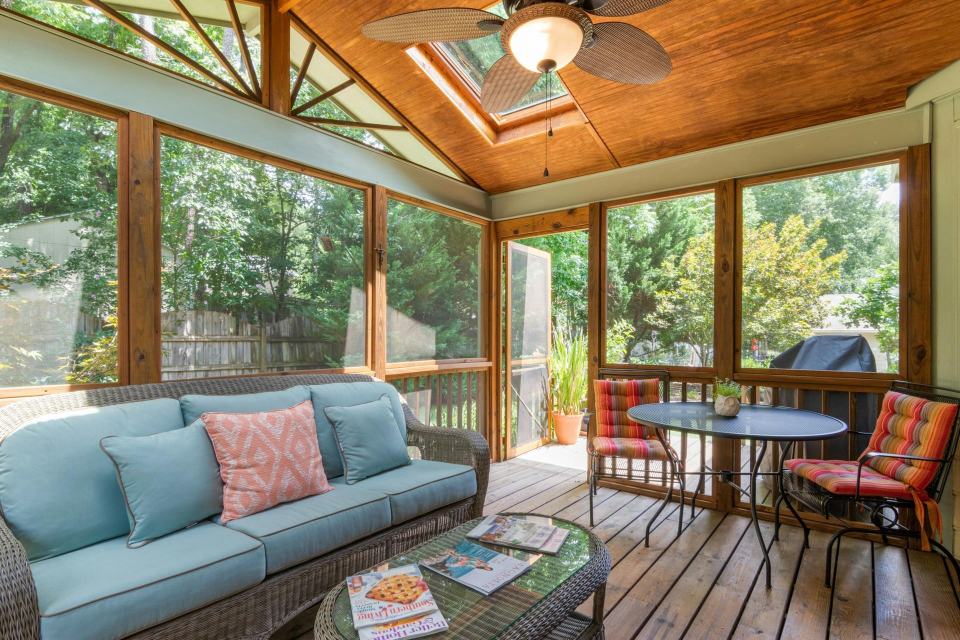 A finished deck with outdoor furniture and built-in seating